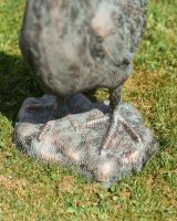 Close up of feet detail on rooster garden statue