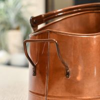 Carry Handle on the Back of the Copper Finish Traditional Fireside Log and Coal Bucket Carry Handle on the Back of the Copper Finish Traditional Fireside Log and Coal Bucket