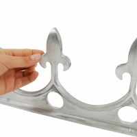 Aluminium Cresting with hand for scale