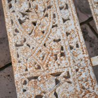 Close up of Antique Cream finish on seat of Cast Iron Bench
