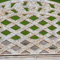 Close up of "Rose Lattice" design on Cast Iron Antique Cream Bench Close up of "Rose Lattice" design on Cast Iron Antique Cream Bench