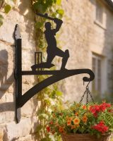 Digital representation of Cricket Player Iron Hanging Basket Bracket mounted on a summer cottage wall Digital representation of Cricket Player Iron Hanging Basket Bracket mounted on a summer cottage wall