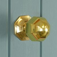 Polished Brass Octagonal door knob on blue door Polished Brass Octagonal door knob on blue door