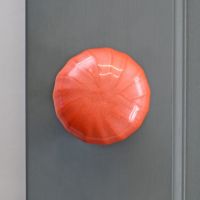 "Sunrise Orange" Hand Finished Ceramic Door Knob on a Grey Door "Sunrise Orange" Hand Finished Ceramic Door Knob on a Grey Door