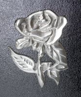 Close-up of the Bright Chrome "Tudor Rose" Design on the Front of the Post Box Close-up of the Bright Chrome "Tudor Rose" Design on the Front of the Post Box