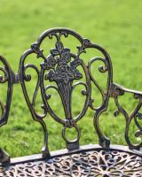 Close-Up of Rosebud Motif on Bench Backrest Close-Up of Rosebud Motif on Bench Backrest