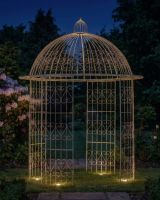 Deluxe Wrought Iron "Alaina" Champagne Powder Coated Gazebo ai illustration at night