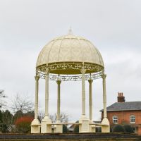 "Demeter"s Dwelling" Cream Gazebo In Front Of A House