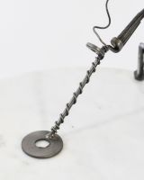 Close up of metal detector detail on scrap metal art sculpture