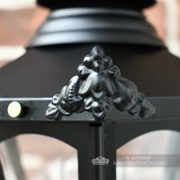 Detailed image of Victorian corner finial on hexagonal wall lantern
