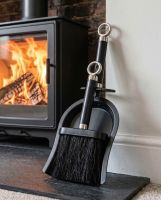 The Bright Chrome and Black Iron Shovel and Brush Next to a White Fireplace with a Log Burner Stove - Digital Illustration