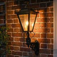 Digital Illustration of the Brass Dorchester Wall Lantern on Royale Bracket Illuminated at Night.