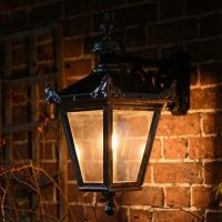 Digital Illustration of the Bright Chrome Suspended Wall Lantern Illuminated at Night Digital Illustration of the Bright Chrome Suspended Wall Lantern Illuminated at Night