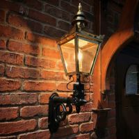 Digital Illustration of the Polished Brass Harrogate Wall Lantern on Bracket Illuminated at Night