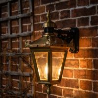 Digital Illustration of the Standard Antique Brass Hanging Wall Lantern Illuminated at Night