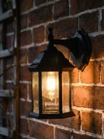 Digital Illustration of the Traditional Black "Hexagonal" Victorian Top-Fix Wall Lantern Illuminated at Night.