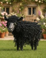 Digital Illustration of a Black version of Twisted Metal Sheep Garden Sculpture in Front of a Countryside Cottage