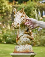 Digital illustration of the Aged Cream Cast Iron Horse Head Bust with hand in shot for scale Digital illustration of the Aged Cream Cast Iron Horse Head Bust with hand in shot for scale