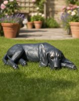 Digital Illustration of Antique Bronze Finish Laying Dog Sculpture on a Sunny Grass lawn Digital Illustration of Antique Bronze Finish Laying Dog Sculpture on a Sunny Grass lawn