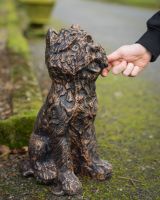 Digital Illustration of Copper Version of ‘Baxter’ the Yorkshire Terrier Garden Sculpture in Cast Aluminium with Hand in Shot for Scale