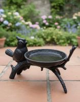 Digital Illustration of Black Cast Iron "Bird On Branch" Bird Feeder on a Tiled Patio