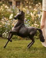 Digital illustration of "Blaze" the Galloping Horse Cast Aluminium Garden Sculpture with hand in shot for scale
