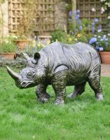 Digital Illustration of Cast Aluminium "Colossus" African Baby Rhino Garden Sculpture in Brushed Bronze on a Garden Lawn Digital Illustration of Cast Aluminium "Colossus" African Baby Rhino Garden Sculpture in Brushed Bronze on a Garden Lawn