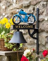 Digital illustration of Cast Iron Hand Painted Blue Motorbike Garden Bell mounted on a stone wall