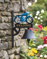 Digital illustration of Cast Iron Hand Painted Blue Motorbike Garden Bell mounted on a rustic stone wall