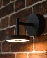 Digital illustration of Contemporary Adjustable Halo Wall Light lit up at night