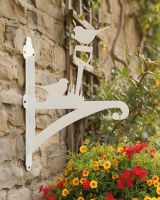 Digital illustration of Cream Robin Iron Hanging Basket Bracket mounted on a cottage wall