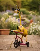 Digital Illustration of ‘Freewheeler” the Upcycled Metal Giraffe Garden Sculpture on a Tricycle on a Garden Patio Digital Illustration of ‘Freewheeler” the Upcycled Metal Giraffe Garden Sculpture on a Tricycle on a Garden Patio