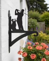 Digital illustration of Golfer Hanging Iron Basket Bracket mounted on a cottage garden wall