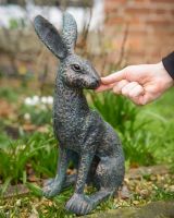 Digital illustration of ‘Hark’ Cast Aluminium Hare Garden Sculpture - Verdigris with hand in shot for scale Digital illustration of ‘Hark’ Cast Aluminium Hare Garden Sculpture - Verdigris with hand in shot for scale