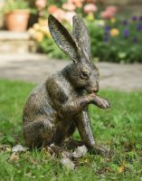 Digital illustration of "Holly" the Housekeeping Hare in Front of a Garden Path