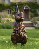 Digital illustration of Mr Rabbit Bronze & Copper Sculpture in Front of a Cottage Garden