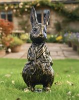 Digital illustration of a Mr Rabbit Brushed Gold Sculpture in a cottage garden