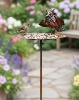 Digital Illustration of Recycled Steel Striking Owl Bird Feeder Garden Spike In a Flowral Garden with a Sparrow using the Feeder