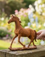 Digital illustration of Rustic Cast Iron "Horse in Gallop" Garden Sculpture with hand in shot for scale