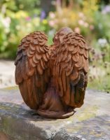 Digital illustration of Rustic Cast Iron Angel in Thought Sculpture view of wings Digital illustration of Rustic Cast Iron Angel in Thought Sculpture view of wings