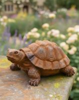 Digital illustration of Rustic Cast Iron Baby Tortoise Garden Sculpture close up on a garden wall