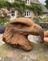 Digital illustration of Rustic Cast Iron Eagle Bust Sculpture with hand in shot for scale