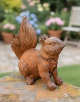 Digital illustration of Rustic Cast Iron Freestanding Squirrel Garden Sculpture side view in garden