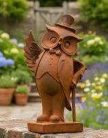 Digital illustration of Rustic Cast Iron Gentleman Owl Sculpture close up on a garden wall