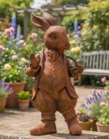 Digital illustration of Rustic Cast Iron Hare with Pipe Sculpture- Large in a garden