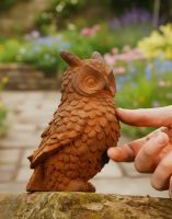 Digital illustration of Rustic Cast Iron Owl Sculpture with hand in shot for scale