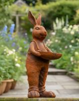 Digital illustration of Rustic Cast Iron Rabbit Holding Bowl Sculpture & Bird Bath low angled view in a garden