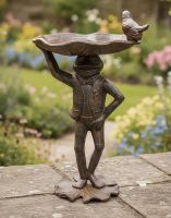 Digital Illustration of Rustic Frog Bird Bath Positioned on a Rustic Garden Wall.jpg