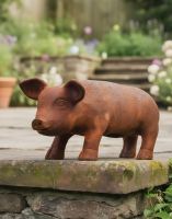Digital illustration of Rustic Iron Pig Sculpture- Medium in a garden