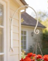 Digital illustration of ’Shepherds Crook’ Wall Bracket for Hanging Baskets - Cream shed mounted on a shed